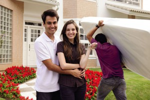 Moving home: Couple infront of new house